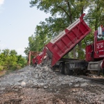 R. J. Corman Dump Truck Unloading Ballast